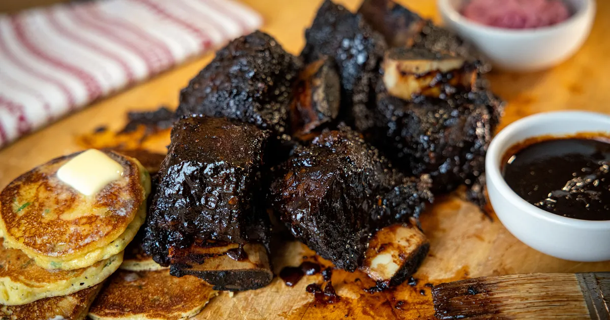 Glazed Short Ribs with Johnny Cakes | Beef Loving Texans | Beef Loving Texans is your one-stop information center for beef recipes, cooking techniques and real life stories. Lean more about beef today. Brought to you by the Texas Beef Council.